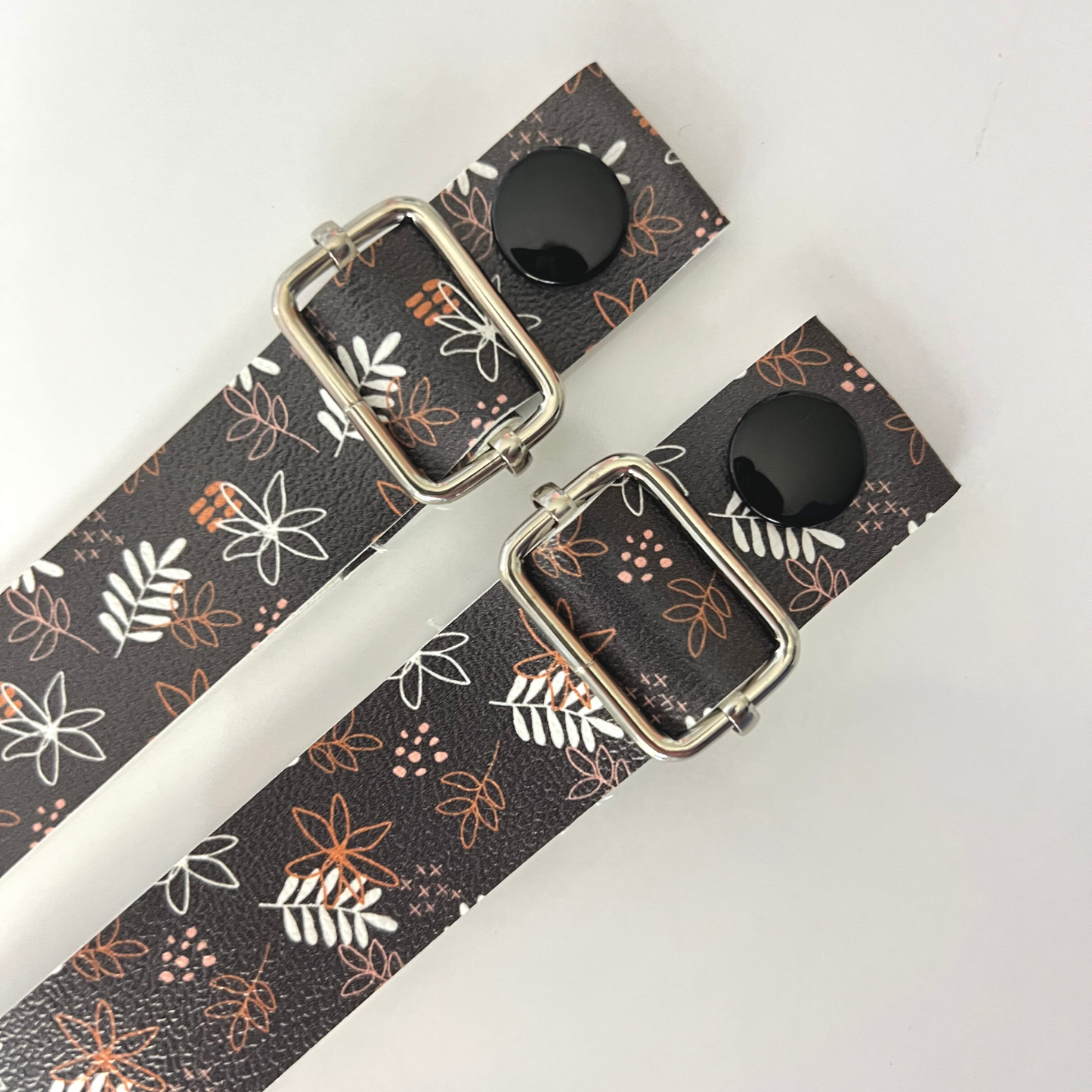 Fall Floral Strap - Vegan Leather: Welcome the autumn season with our Fall Floral Strap, crafted from premium vegan leather. This strap is adorned with warm and simple fall-inspired flowers, adding a touch of seasonal charm to your apron attire.