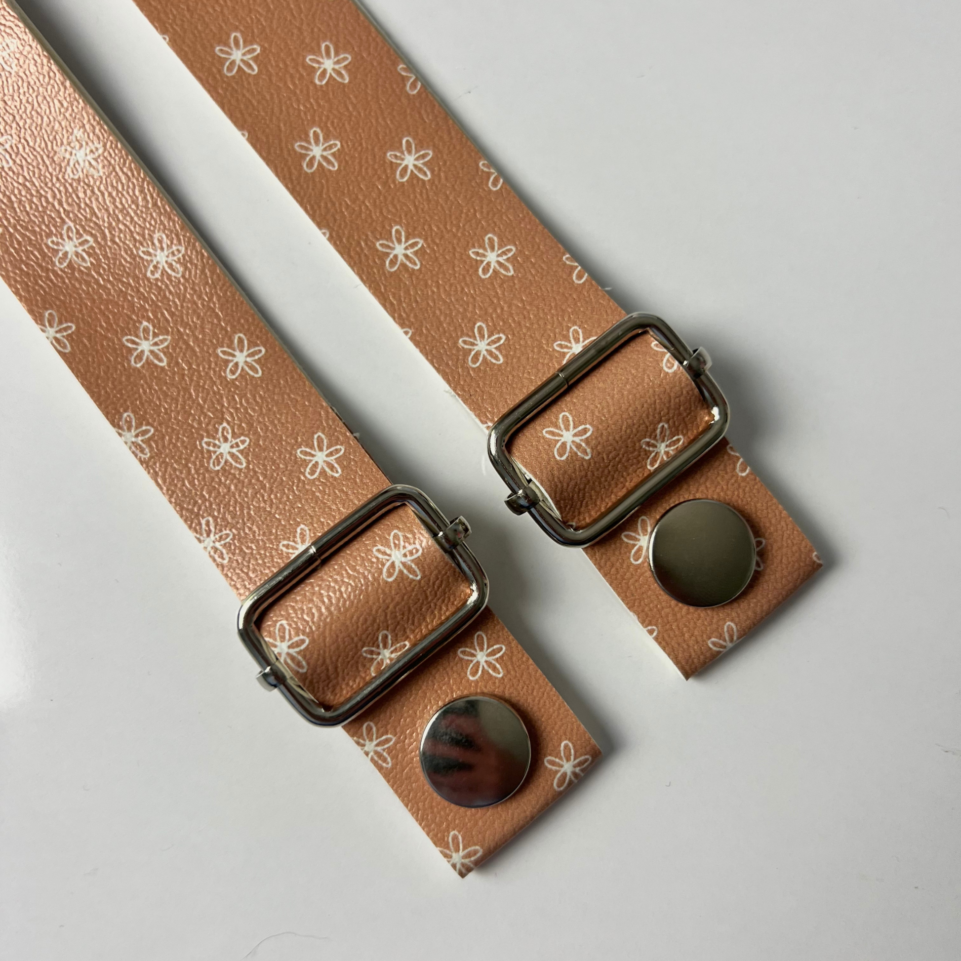 Earthy Boho Flower Strap - Vegan Leather: Channel the bohemian spirit with our Earthy Boho Flower Strap, made from vegan leather. This strap showcases a captivating earth-toned background with doodled daisies, perfect for those who appreciate the beauty of the natural world.